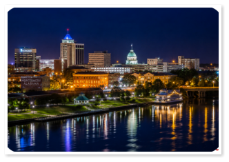 Downtown Montgomery skyline at sunset near Roses RV River Resort