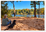Relaxing by the river with our furry companions at Roses RV Resort.